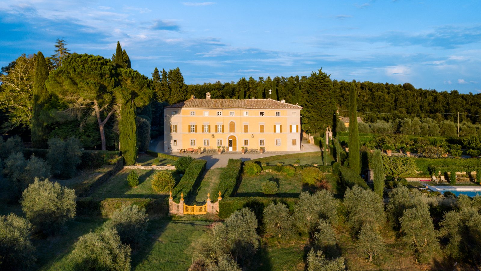 The Montechiaro villa among cypresses and olive groves in the Sienese hills