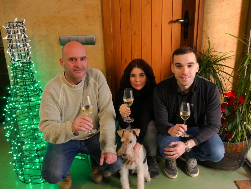 The Solà Raventós family at the cellar, glasses of cava in hand